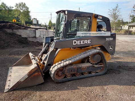 john deere 323 d skid steer track adjustment|john deere 323d specifications.